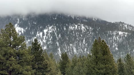 White-Mist-Rolling-Over-The-Snow-Capped-Sierra-Nevada-Mountain-Range-Of-Reno-Tahoe