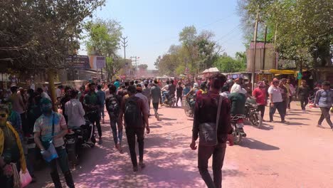 pov-shot-cutting-men-walking-towards-the-temple-where-stalls-of-different-items-are-visible