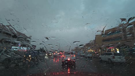 Heavy-rain-in-the-UAE:-A-view-from-the-car-dashcam-capturing-rainfall-in-Dubai,-United-Arab-Emirates