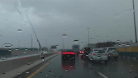 Heavy-rain-in-the-UAE:-A-view-from-the-car-dashcam-capturing-rainfall-in-Dubai,-United-Arab-Emirates