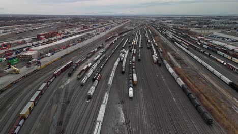 Canadian-National-Railway-St-Laurent-Montreal-Quebec-Canada-,-drone-fly-above-the-train-station-with-cargo-freight-Wagon