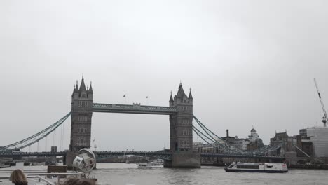 River-Cruise-Boats-Passing-Under-The-Tower-Bridge-In-London,-United-Kingdom