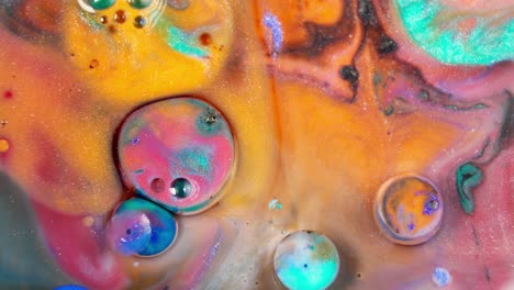 Color-tablets-dissolving-in-colorful-liquid-ink-art-creating-bubbles