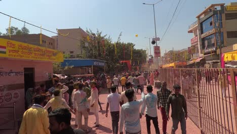 pov-shot-Many-people-are-walking-towards-the-temple-where-many-buildings-and-various-stores-are-visible-around