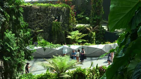 Tourists-visiting-the-Cloud-Forest-greenhouse-conservatory-at-Gardens-by-the-bay,-the-iconic-attraction-of-Singapore,-static-shot