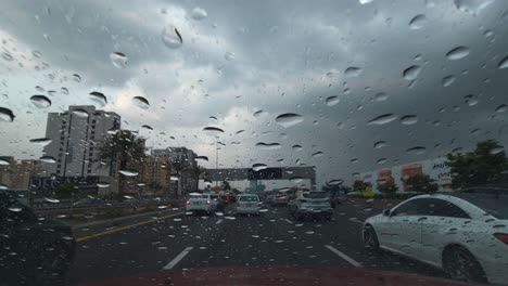 Heavy-rain-in-the-UAE:-A-view-from-the-car-dashcam-capturing-rainfall-in-Dubai,-United-Arab-Emirates