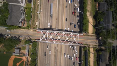 Birds-eye-view-of-car-traffic-on-59-South-freeway-in-Houston,-Texas