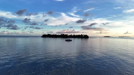 Aerial-Footage-of-Floating-Boat-on-the-Ocean-in-Sunset-Scenery