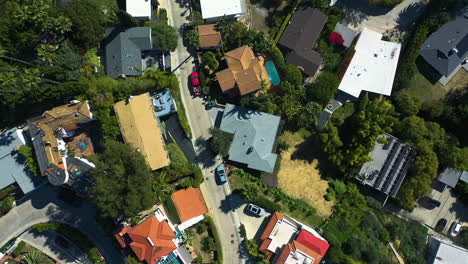 Birds-eye-aerial-above-rich-villas,-in-sunny-Hollywood-hills,-Los-Angeles,-USA