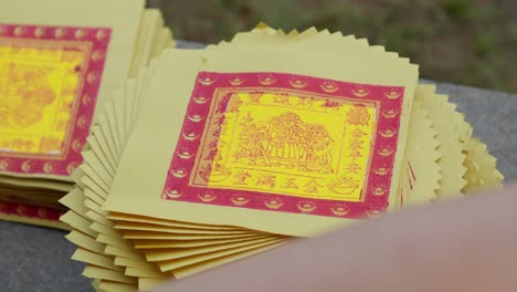 Stack-Of-Yellow-Chinese-Joss-Papers-For-Traditional-Ritual-Ancestor-Worship-Offering