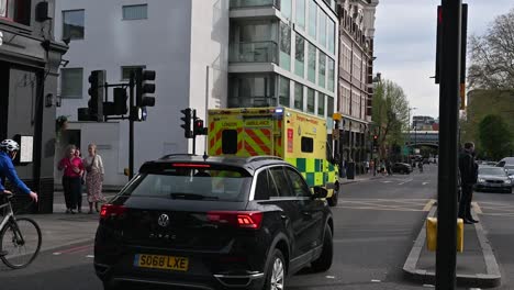 An-ambulance-going-south-from-Tower-Bridge,-London,-United-Kingdom