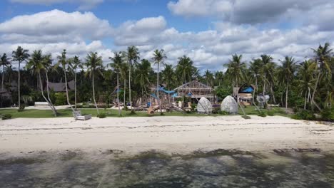 Nay-Palad-Beach-Resort-amid-Tropical-Foliage-Under-Construction-Work,-Drone-Trucking