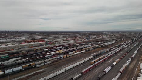 St-Laurent-Montreal-Quebec-Canada-,-drone-approaching-the-train-station-with-cargo-freight-Wagon-,-logistic-shipment-import-export-concept