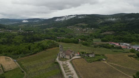 Santa-Maria-de-Beade-Church-Amidst-Verdant-Hills-in-Beade,-Spain