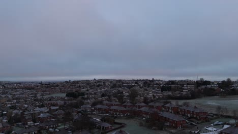 Drone's-eye-winter-view-captures-Dewsbury-Moore-Council-estate's-typical-UK-urban-council-owned-housing-development-with-red-brick-terraced-homes-and-the-industrial-Yorkshire