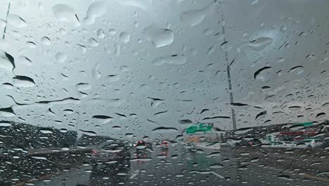 Heavy-rain-in-the-UAE:-A-view-from-the-car-dashcam-capturing-rainfall-in-Dubai,-United-Arab-Emirates