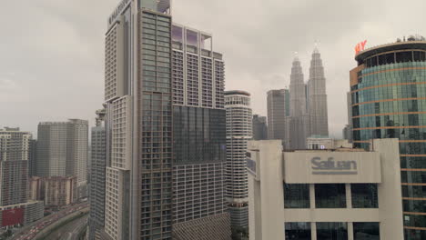 Circling-Kuala-Lumpur-Skyscrapers-On-Humid-Evening