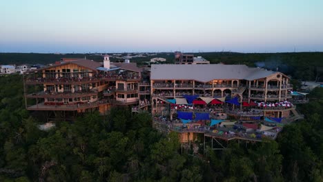 Flying-towards-the-famous-Oasis-Restaurant-on-Lake-Travis,-Austin,-Texas,-USA