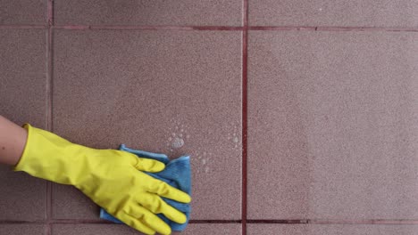 Woman-cleaning-tile-floors-outdoors,-spring-cleaning