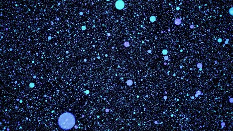 Visual-effects,-VFX,-blue-particles-on-space-on-black-background-3D-animation