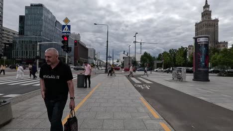 Exploring-the-pedestrian-zones-of-Warsaw,-Poland,-reveals-landmarks-like-the-Palace-of-Culture-and-Science-alongside-modern-architectural-wonders