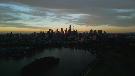 Aerial-view-of-a-moody-sunset-in-Albert-Park-and-Lake,-Melbourne,-Australia