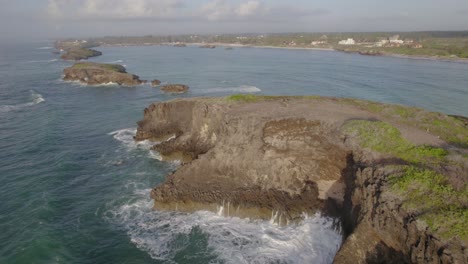 Close-up-reveal-drone-video-of-Island-rock-face,-Watamu-Kenya