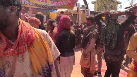 pov-shot-Many-men-are-dancing-in-the-middle-of-the-road-and-a-brother-Abeel-is-flying-a-gulal