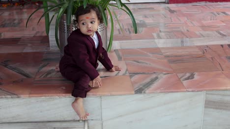 cute-indian-toddler-walking-in-suit-at-outdoor-from-different-angle