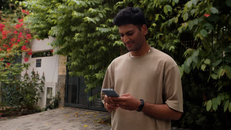 Concerned-guy-using-smartphone-outdoors