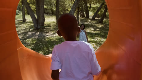 Mother-and-son-waving-at-the-park