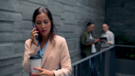 Person-holding-coffee-cup-on-a-break