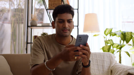 Indian-guy-using-smartphone