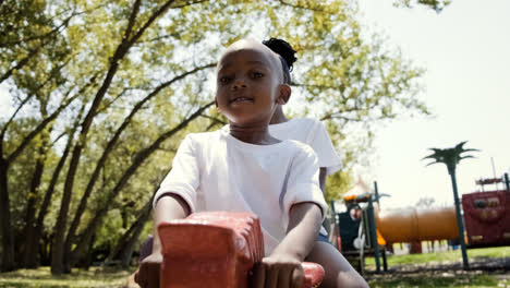 Happy-kids-sitting-on-a-rocking-horse