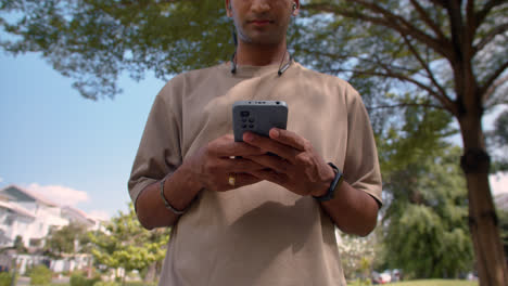 Man-using-smartphone-outdoors