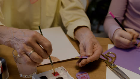 Senior-woman-painting-Easter-eggs