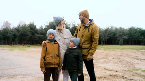 Family-smiling-at-camera