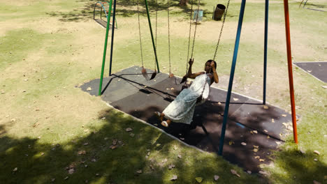 Woman-sitting-on-a-swing