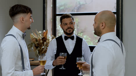 Groom-toasting-with-friends