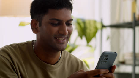 Indian-guy-using-smartphone