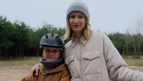 Mom-and-son-smiling-at-camera