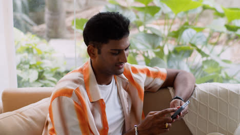 Indian-guy-using-smartphone