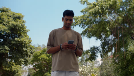 Man-using-smartphone-outdoors