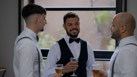 Groom-toasting-with-friends