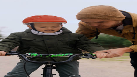 Dad-teaching-son-how-to-ride-bike