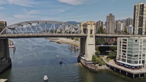 Vancouver-BC-Canada-Aerial-v113-drone-fly-under-the-Burrard-street-bridge-capturing-Sunset-beach-park,-West-End-residential-and-downtown-cityscape-in-summer---Shot-with-Mavic-3-Pro-Cine---July-2023