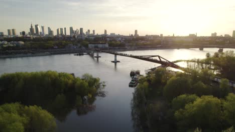 Agrafka-Bridge-Spanning-The-Vistula-River-At-Sunset-In-Warsaw,-Poland