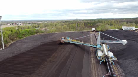 Chvaletice-Power-Station,-Chvaletice,-Czech-Republic---Handling-Coal-at-the-Power-Plant---Drone-Flying-Forward