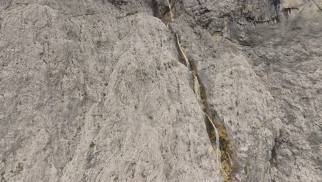 Cinematic-aerial-view-of-Murfreit-waterfall-near-Passo-Gardena