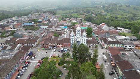 Aerial-view-flying-over-Parque-Bolivar-and-the-church-Parroquia-Inmaculada-Concepción-de-Filandia-in-the-Andean-town-of-Filandia-in-the-Quindío-department-of-Colombia